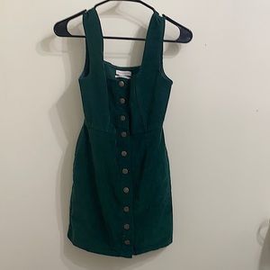 A dark green overall dress